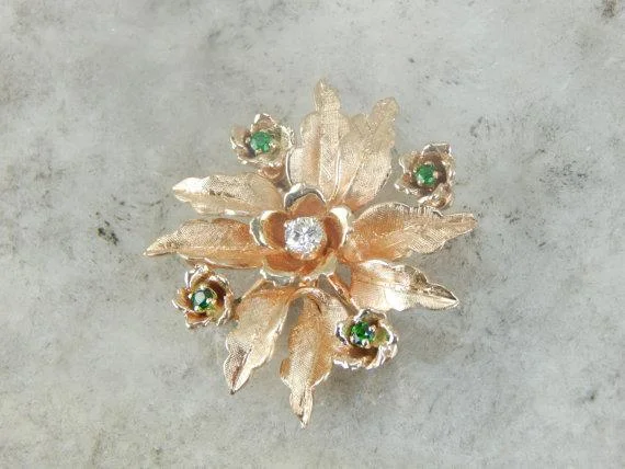 Ladies companion bond brooches -Mid-Century Diamond and Demantoid Garnet Flower Brooch