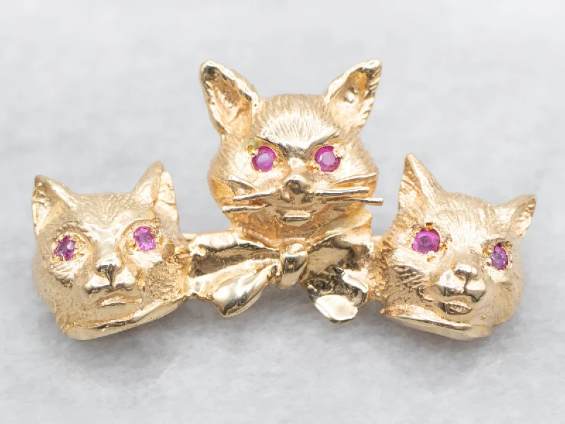 Ladies hopeful spark brooches -Gold Cat Brooch with Synthetic Ruby Eyes